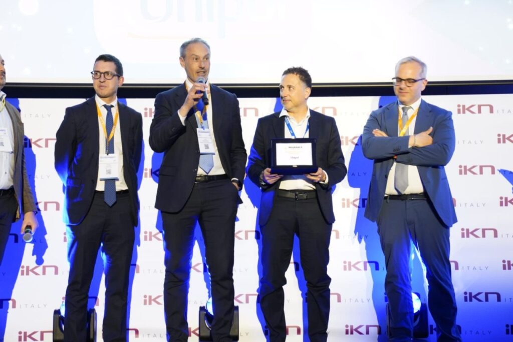 Unipol team accepting the Best Innovative Project award at the Italy Insurance Forum 2026 in Milan